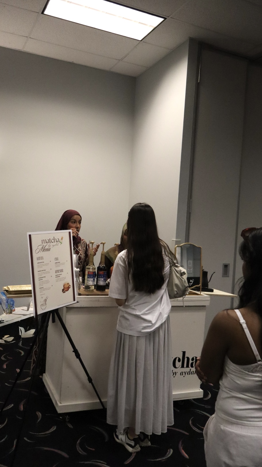 Matcha by Aydah menu stand at a pop-up