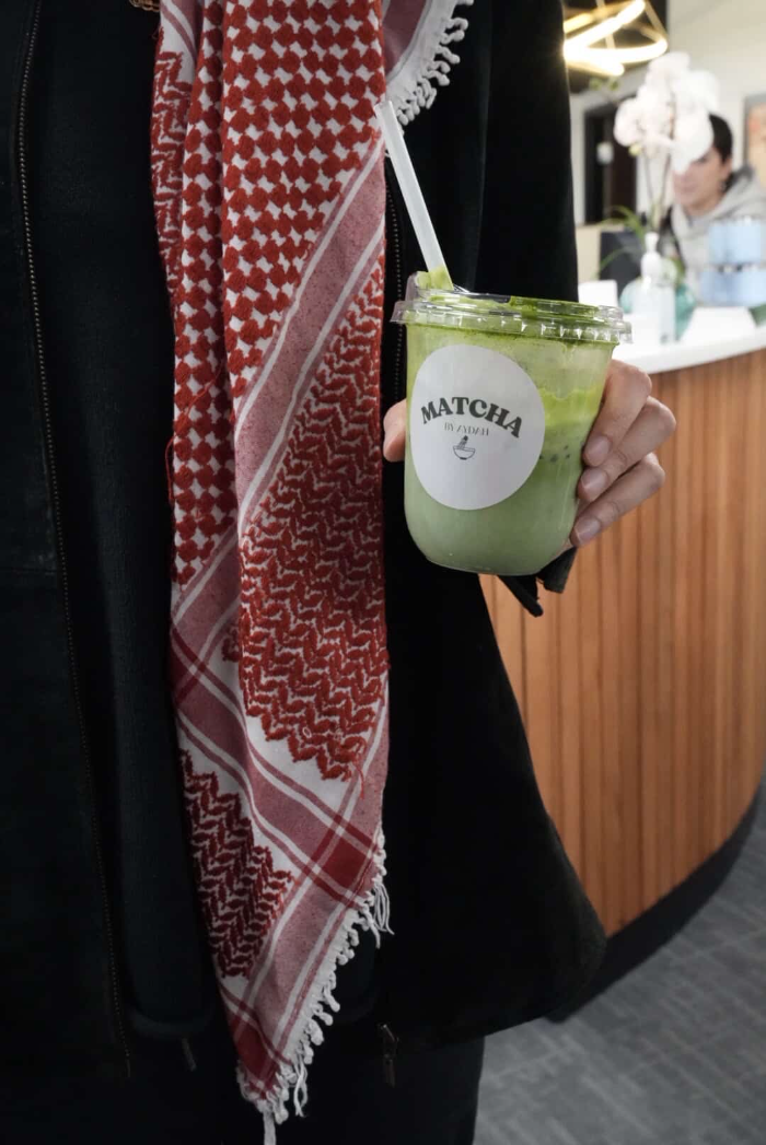 Matcha by Aydah held on the go